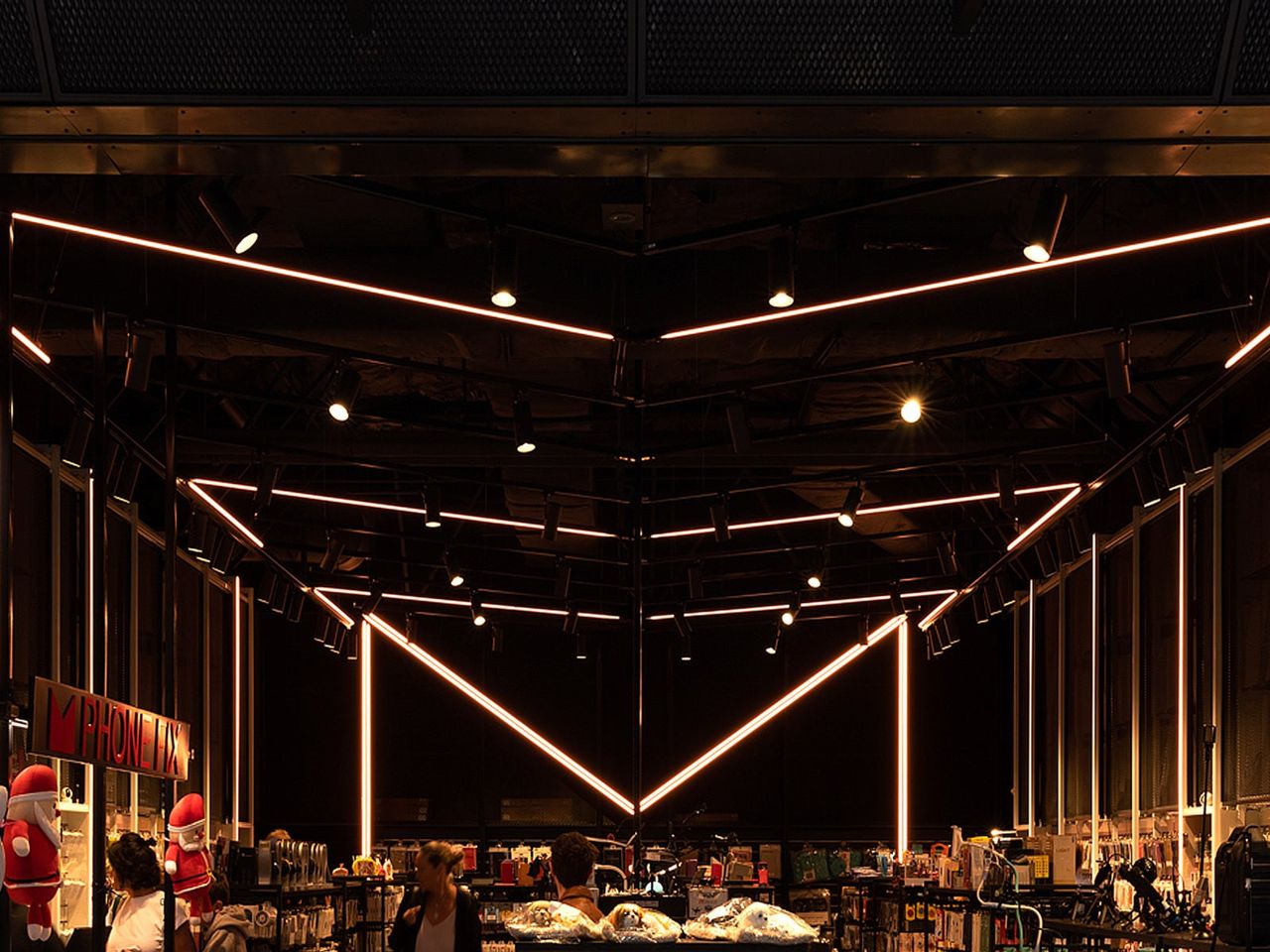 Modern lighting design at Mobie retail fit-out in Westfield Newmarket, showcasing angular LED strips and sleek interior architecture.