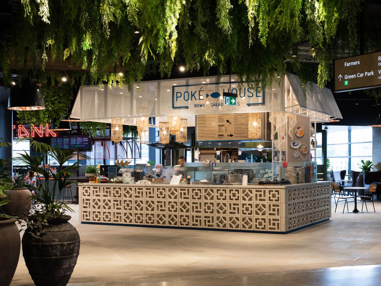Poke House restaurant at Westfield Mall, showcasing a stylish open-plan design with greenery, patterned counters, and a contemporary hospitality interior. A prime example of innovative retail and restaurant design in Auckland.