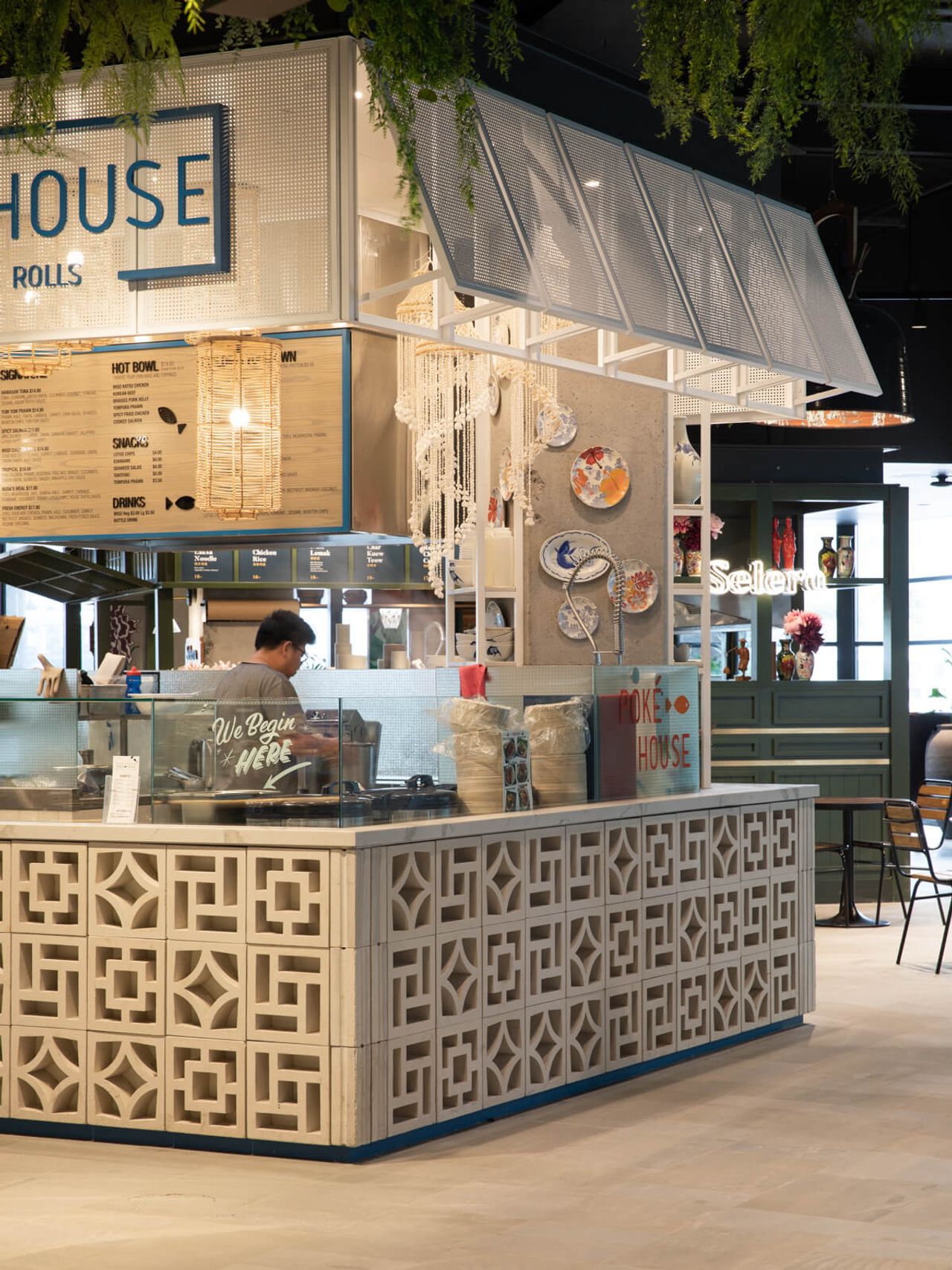 Modern restaurant interior design for Poke House in Westfield Mall, featuring intricate patterned counters, vibrant decor, and contemporary architectural elements. Ideal for hospitality and retail spaces showcasing innovative interior design in Auckland.